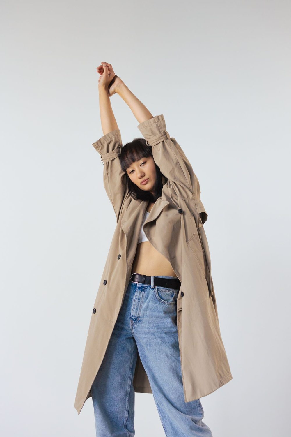 Brown coat paired with blue jeans