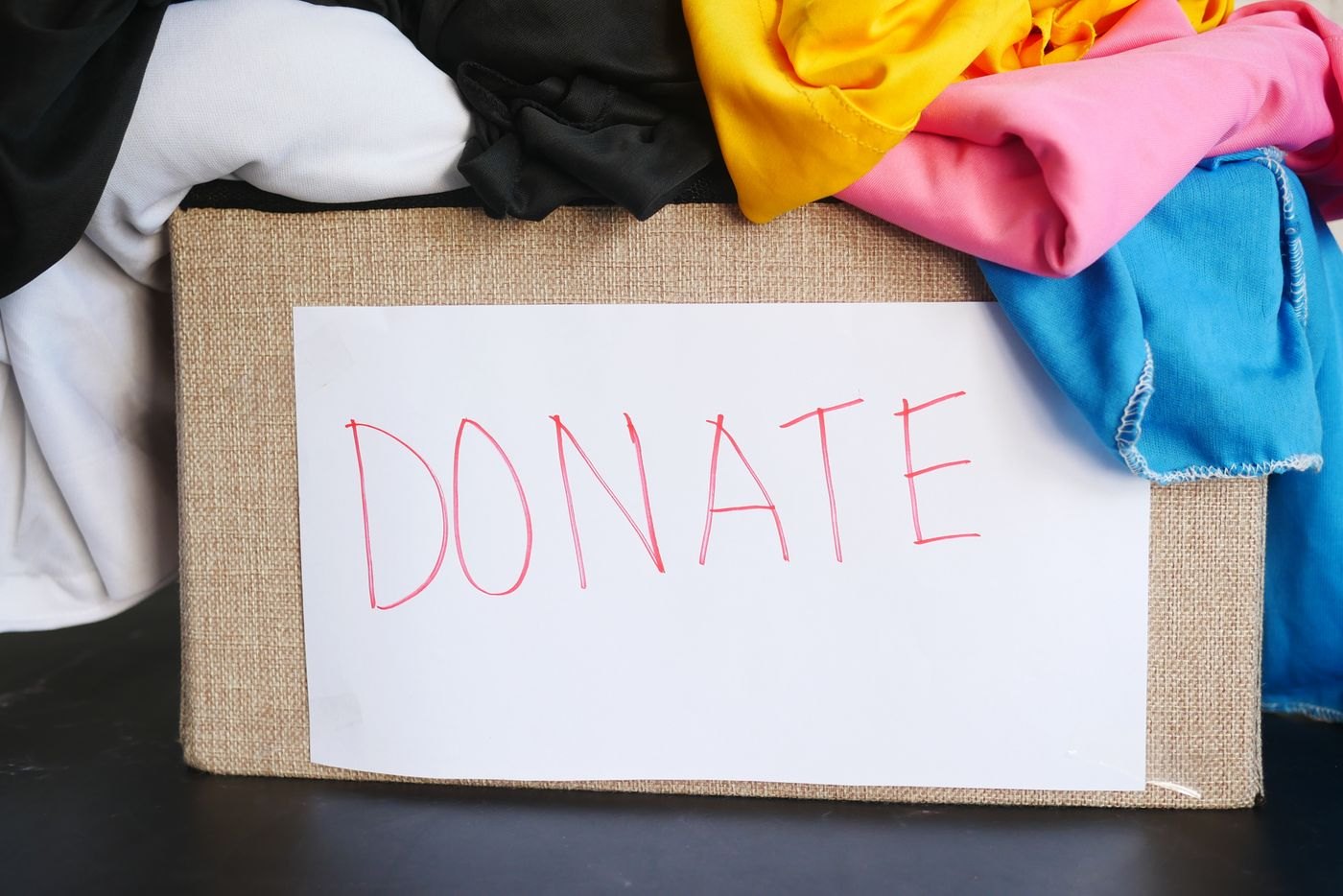 Folded clothes ready in a donation box