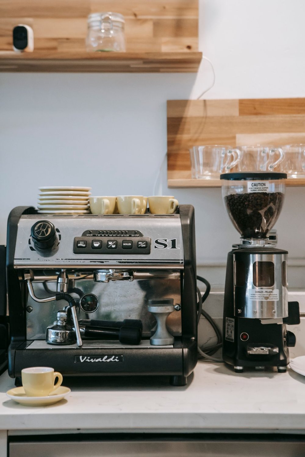 Coffee machine and grinder on a kitchen counter