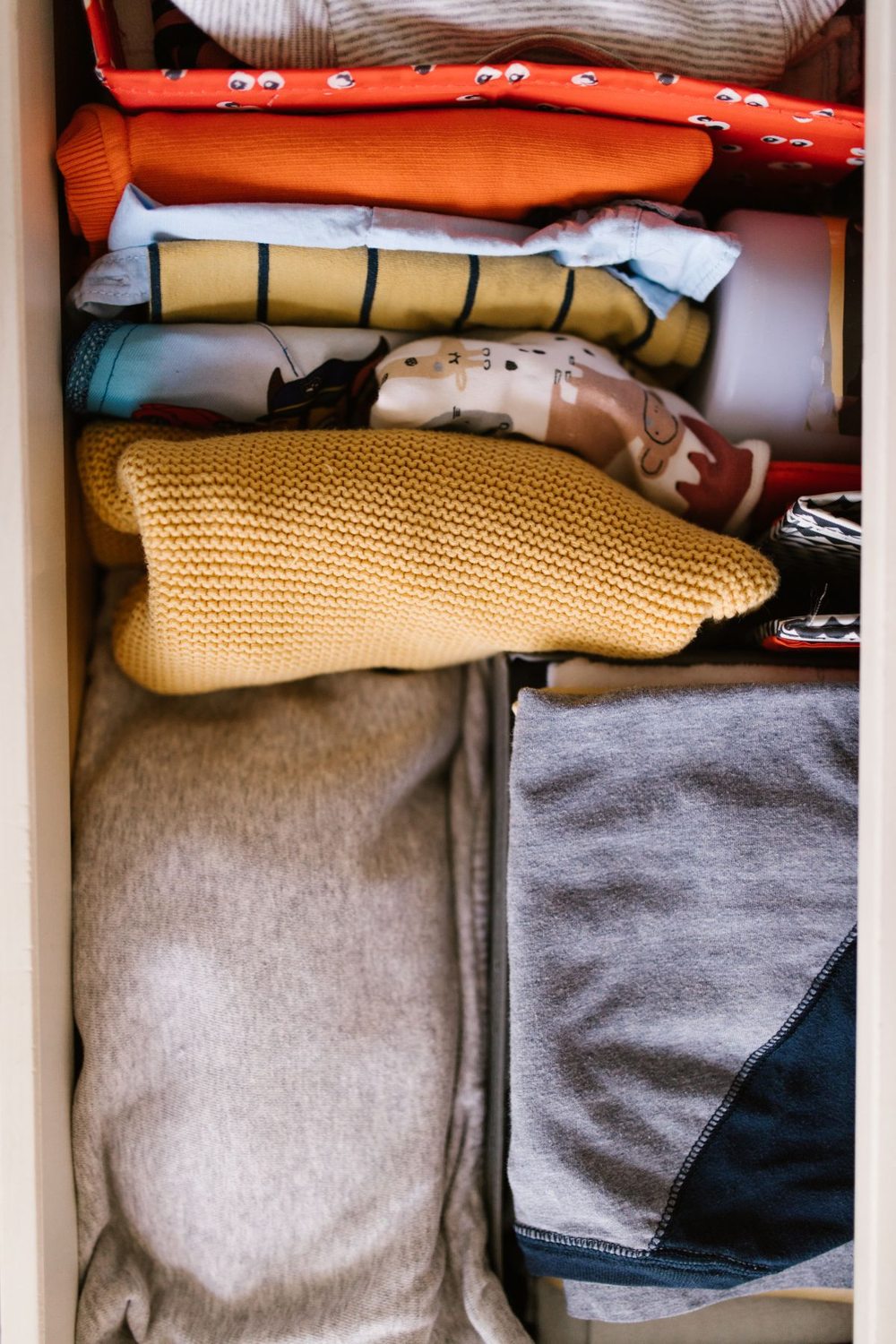 Folded clothes arranged in a drawer