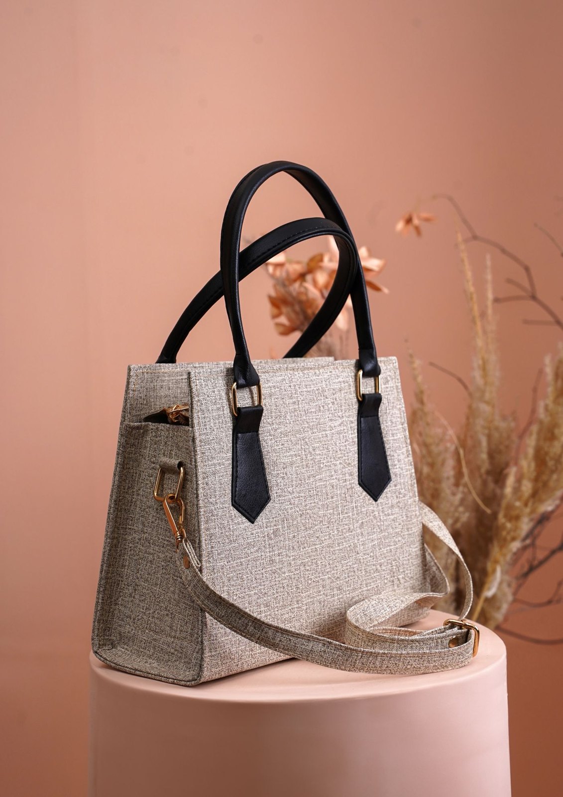 Beige everyday handbag with dark handles