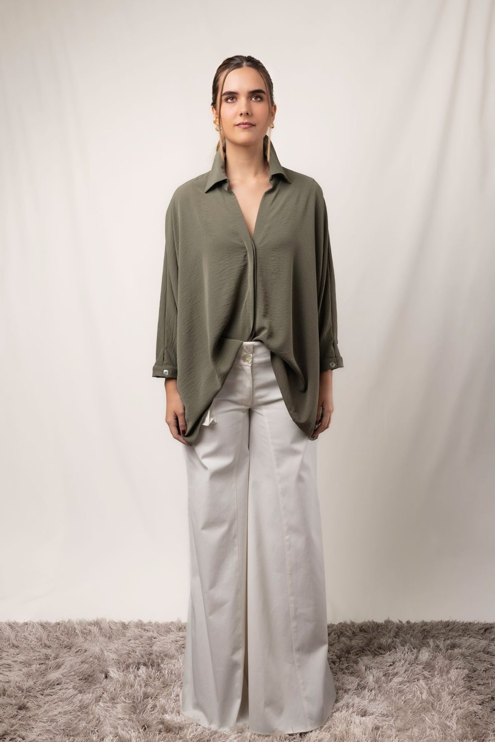 Oversized shirt worn with wide-leg trousers