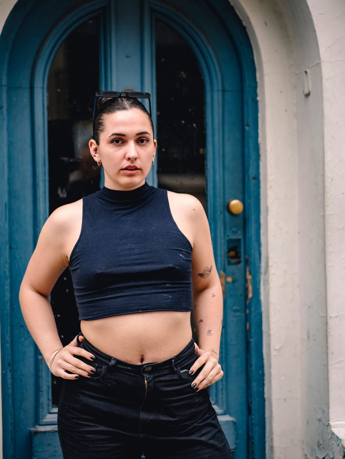 Navy blue top worn with black trousers